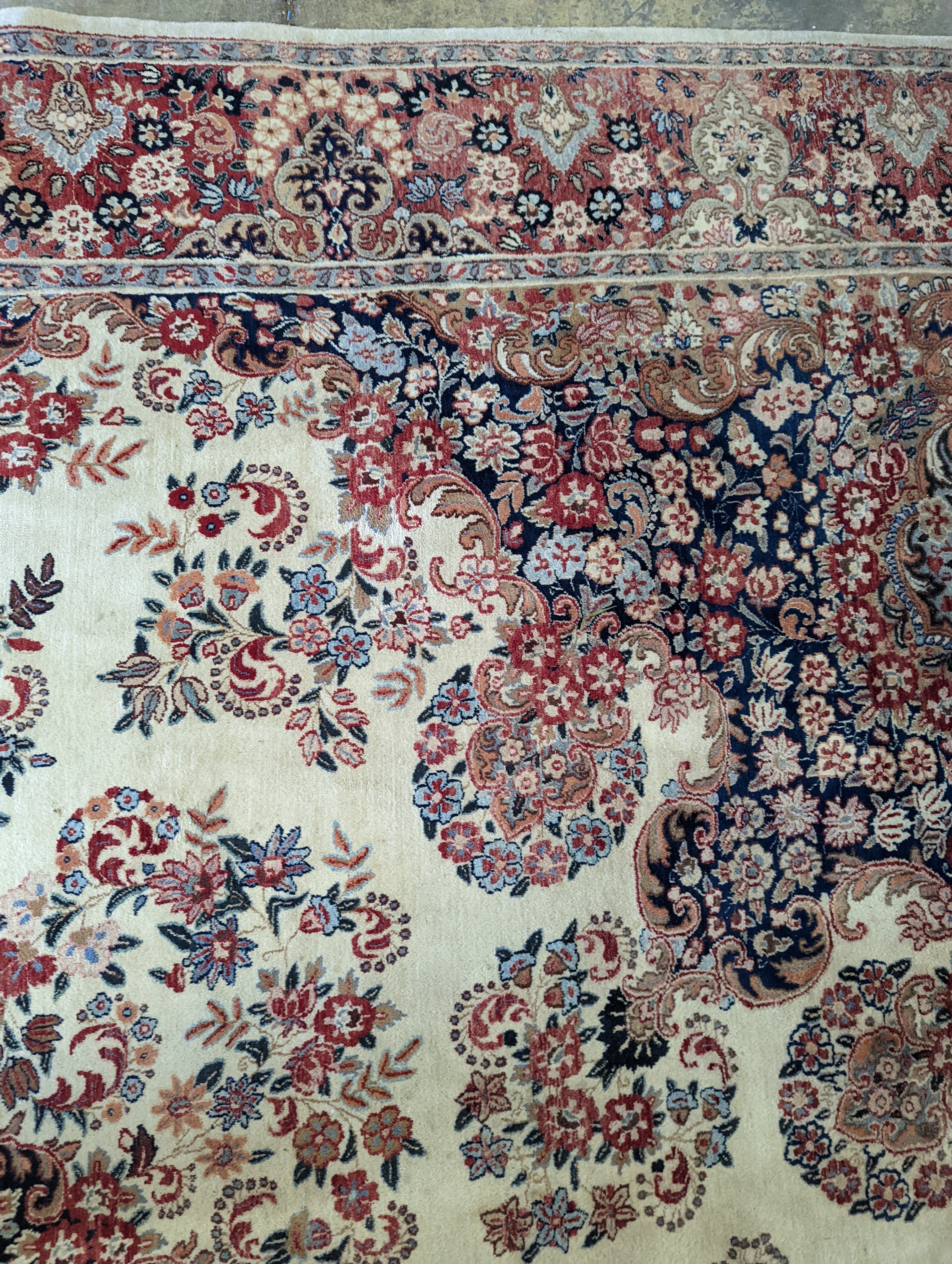 A North West Persian ivory ground carpet, 410 x 310cm